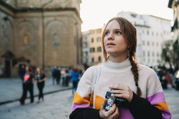 istock A woman is exploring the city at sunset 1487545681