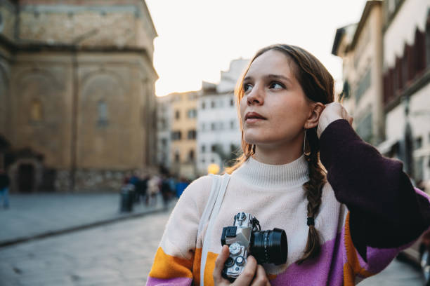 istock A woman is exploring the city at sunset 1487545695