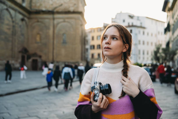 istock A woman is exploring the city at sunset 1487545737