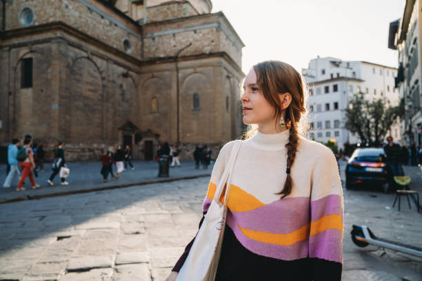 istock A woman is exploring the city at sunset 1487545751