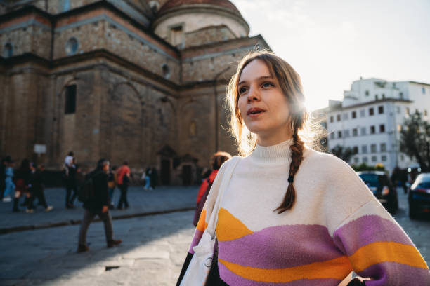 istock A woman is exploring the city at sunset 1487545753