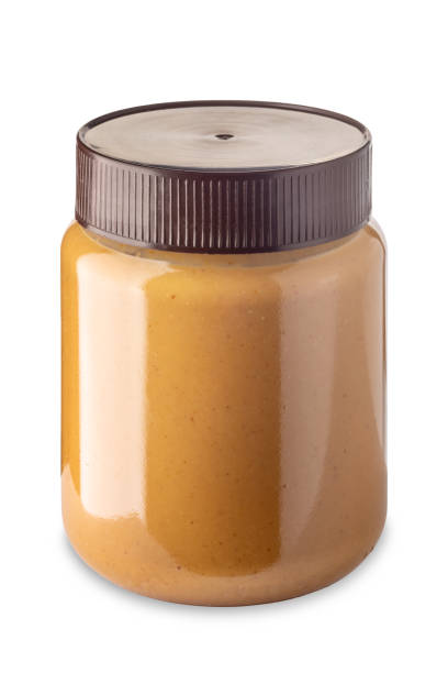 istock Peanut butter in glass jar 1487551414