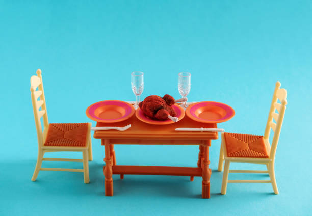 Plastic doll furniture on a blue background.