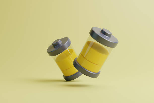 istock Two batteries with yellow level indicator on light yellow background 1487557181