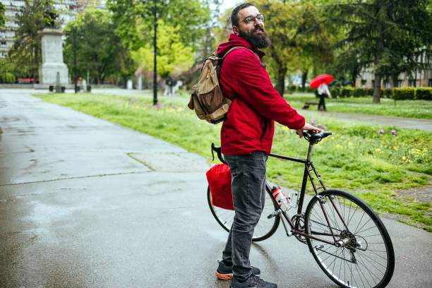Portrait of a man with a bicycle in the park