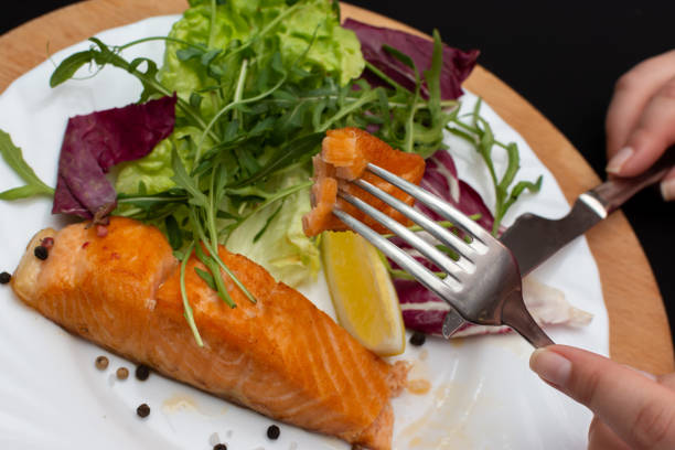 istock We try a delicious salmon steak with salad 1487561730