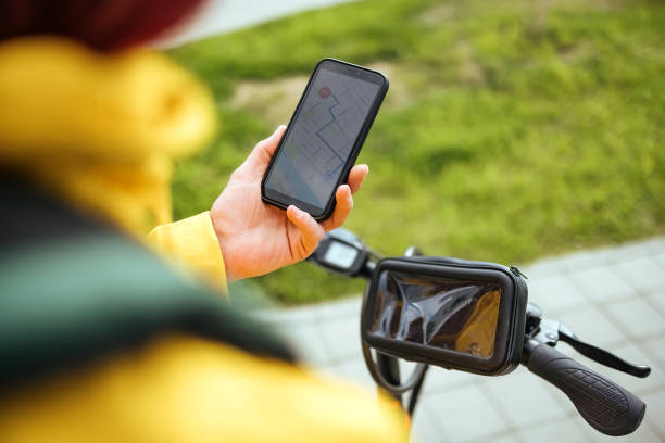 istock Female delivery person accepts next ride. 1487562003