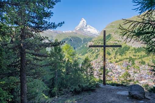 The Matterhorn peak with the cross over the Zermatt.