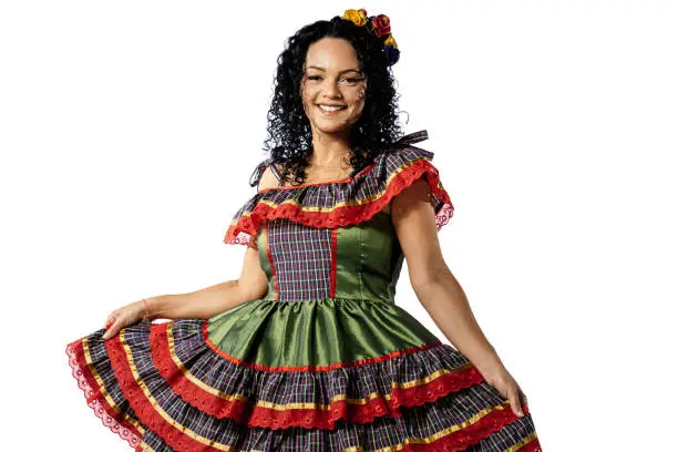 Photo of Brazilian woman wearing typical clothes for the Festa Junina dancing on white background