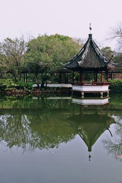istock Idyllic small pavilion nestled among lush greenery in a peaceful park 1487569671