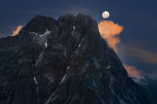 aerial view with moon of the great horn of the mountain complex of the gran sasso d'italia