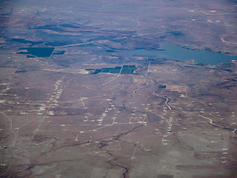 Aerial view of many oil and gas drilling pads in the Mexican desert.