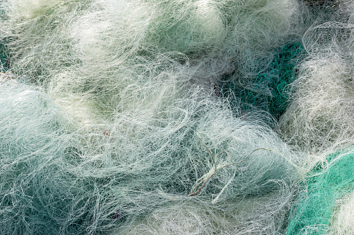 Background of Used fishing net. Fishing industry waste