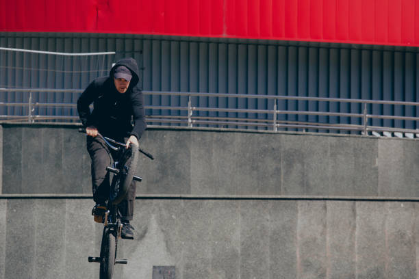 istock BMX rider performs stunts in the city 1487576007