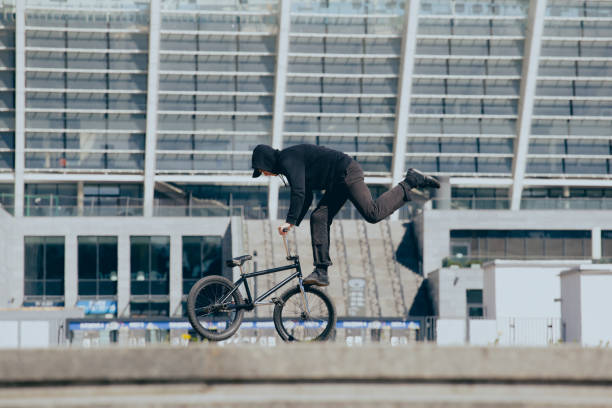 istock BMX rider performs stunts in the city 1487576009