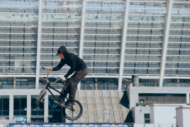 istock BMX rider performs stunts in the city 1487576013