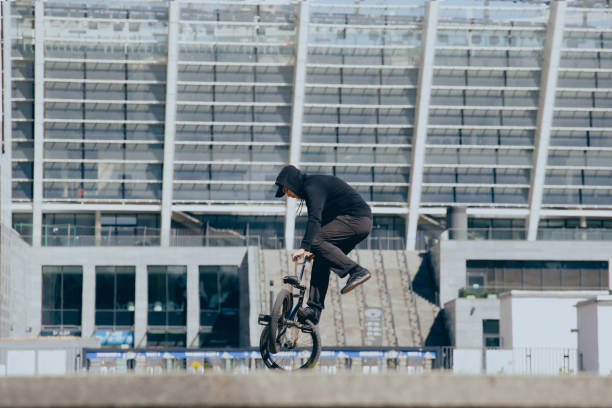 istock BMX rider performs stunts in the city 1487576014