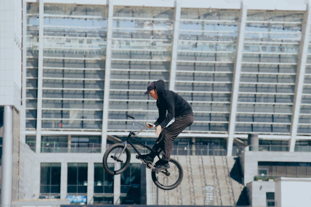 istock BMX rider performs stunts in the city 1487576028