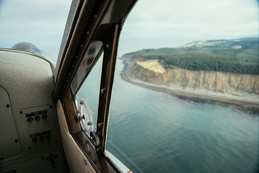seattle coastline view through window of seaplane