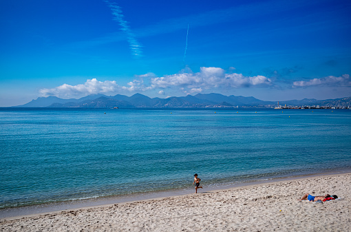 Two views of the beachfront in Cannes, France on the Mediterranean Sea.  beautiful vistas are enjoyed by all that come to the beach here.