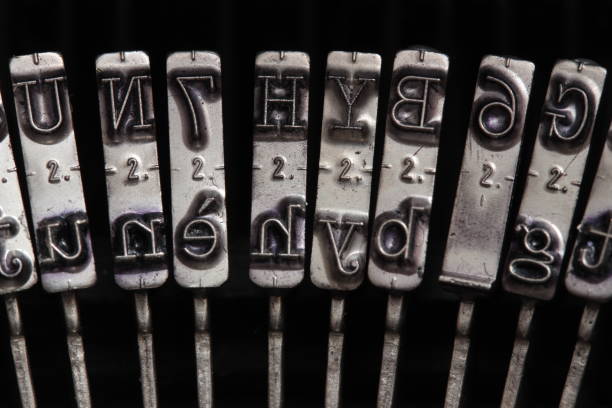 Black and white macro shot of typewriter heads.