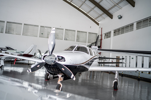 Private airplane in the airport hangar