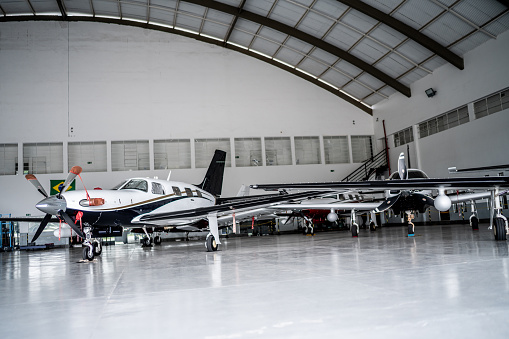 Private airplanes in the airport hangar
