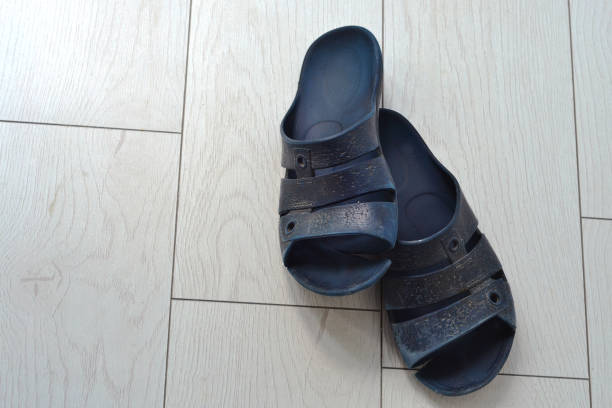 istock Blue men's slippers are on the floor 1487579150