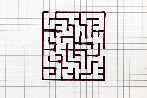 labyrinth is drawn in a notebook, the concept of finding a path and confusion