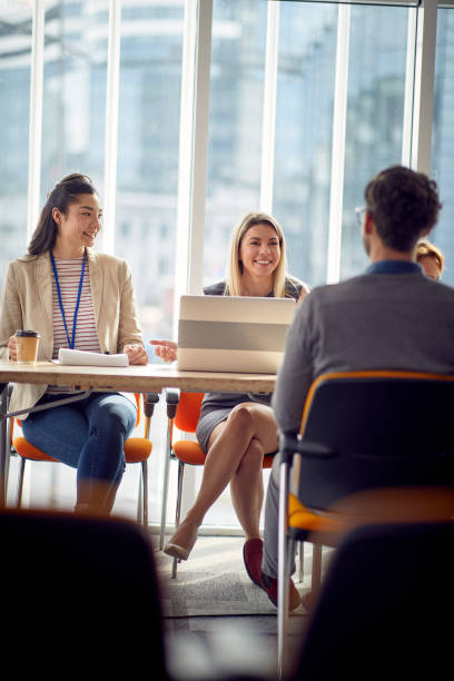 istock business women discussion in the office 1487580272