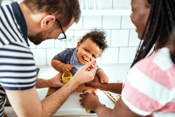 istock Parents feed their baby 1487581424