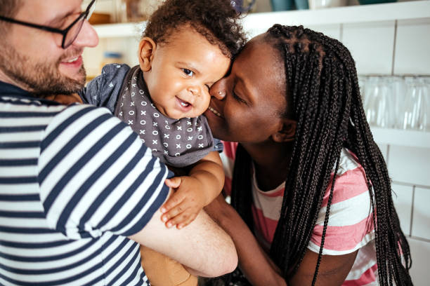 istock Authentic moment between parents and baby 1487581793