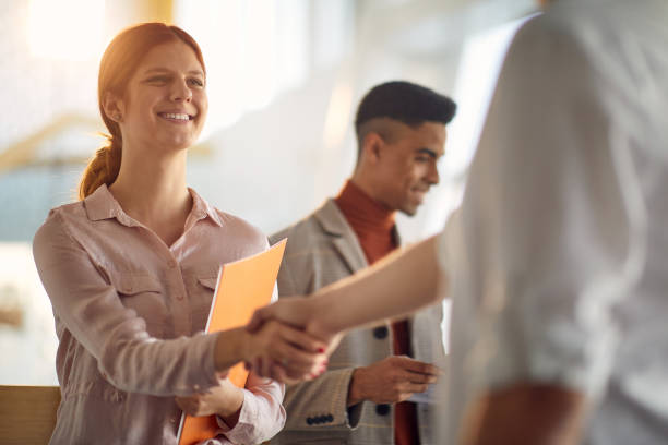 istock Young employee receiving a congratulations 1487581802