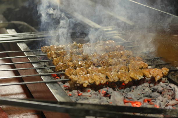 istock shish kebab on the grill. Close up meat. 1487582755