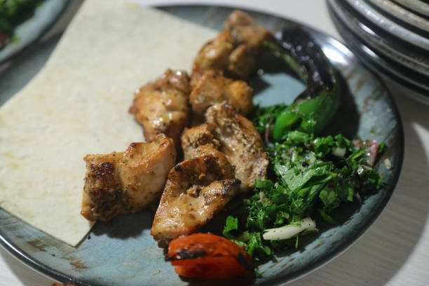 istock shish kebab on the grill. Close up meat. 1487584658