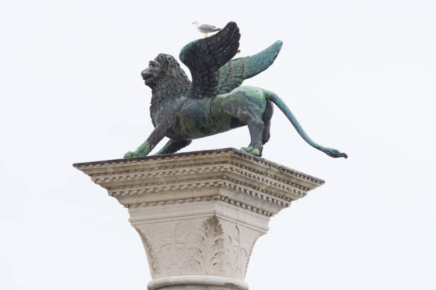 istock Winged lion of Venice standing on a column in St. Mark Square 1487585837