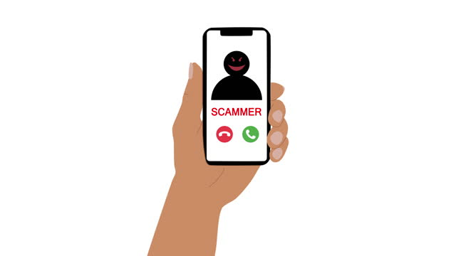 The hand holds the phone to which the call from the scammer arrives. The concept of online crime. Incoming calls, phone screen with an unknown number, picture of the scammer on the screen.