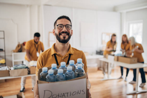 istock Volunteer working in charity center 1487592444