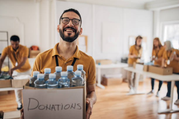 istock Volunteer working in charity center 1487592573