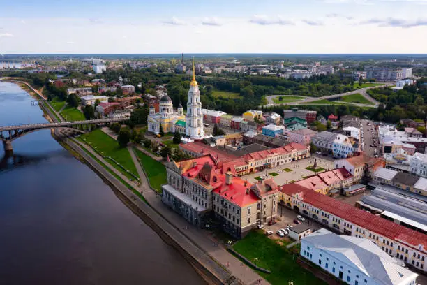 Aerial view of the administrative center of the city of Rybinsk with the Transfiguration Cathedral, as well as the original 
road bridge over the Volga River on a summer day, Russia