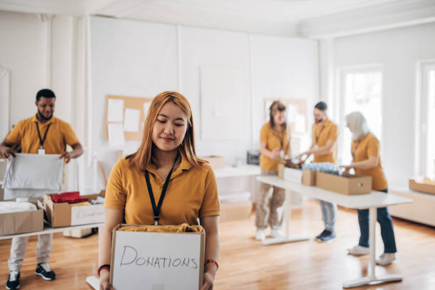 istock Volunteers in charity center 1487595634