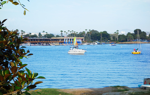 San Diego, CA - August 7, 2022:  Recreational boats and yachts sailing through warm waters of Mission Bay near Ventura Cove