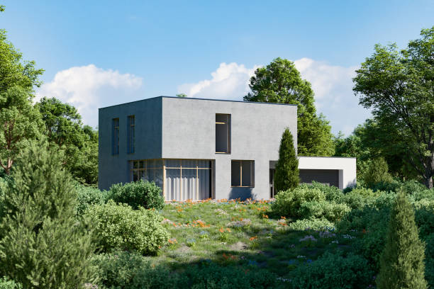 istock Modern new concrete house with lush garden 1487607056