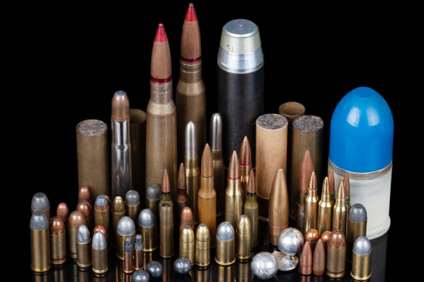 istock Ammunition isolated on black background with reflexion. Different cartridges for rifle, pistols and revolvers on a black. 1487610377