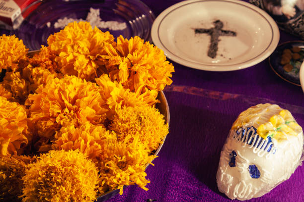 Detail of day of de Dead offering at home, illuminated by candlelight