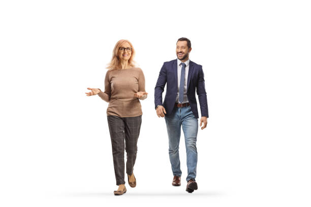 istock Mature woman walking and smiling with a younger man 1487619554