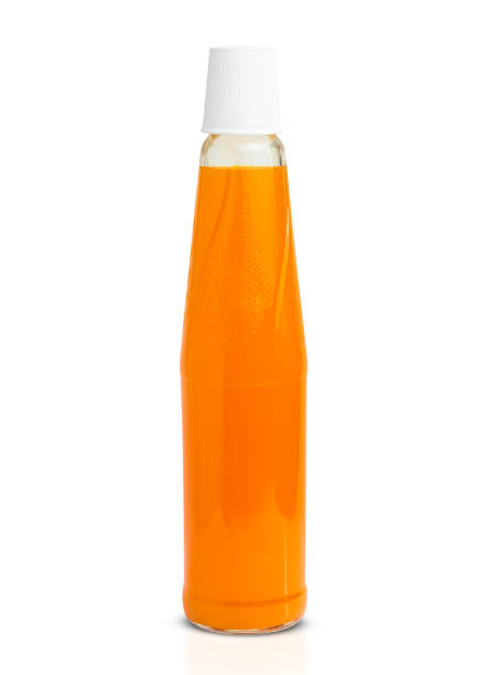 istock Orange juice glass bottle. Isolated on white background with clipping path 1487621475