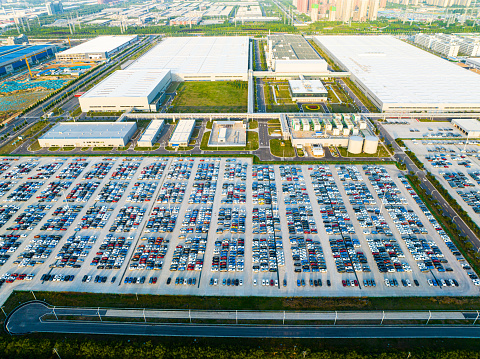Aerial View of new cars parked in the automobile factory parking area