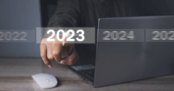 istock Welcome year 2023. Businessman hand pressing button New Year 2023. 1487638662