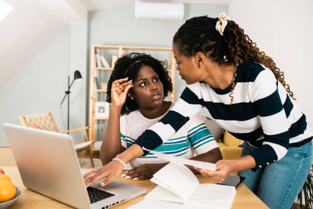 istock Beautiful young women working online from home 1487640804